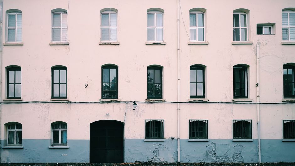 Painted house wall with a window and trim